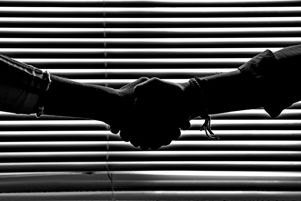 Black and white image of a handshake